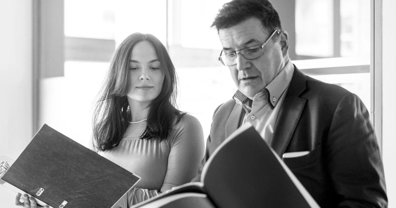 Two associates looking at financial information