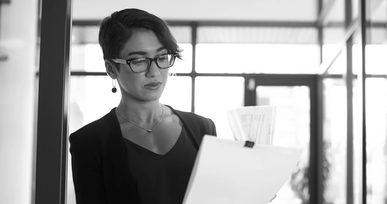 A woman looking at financial documents